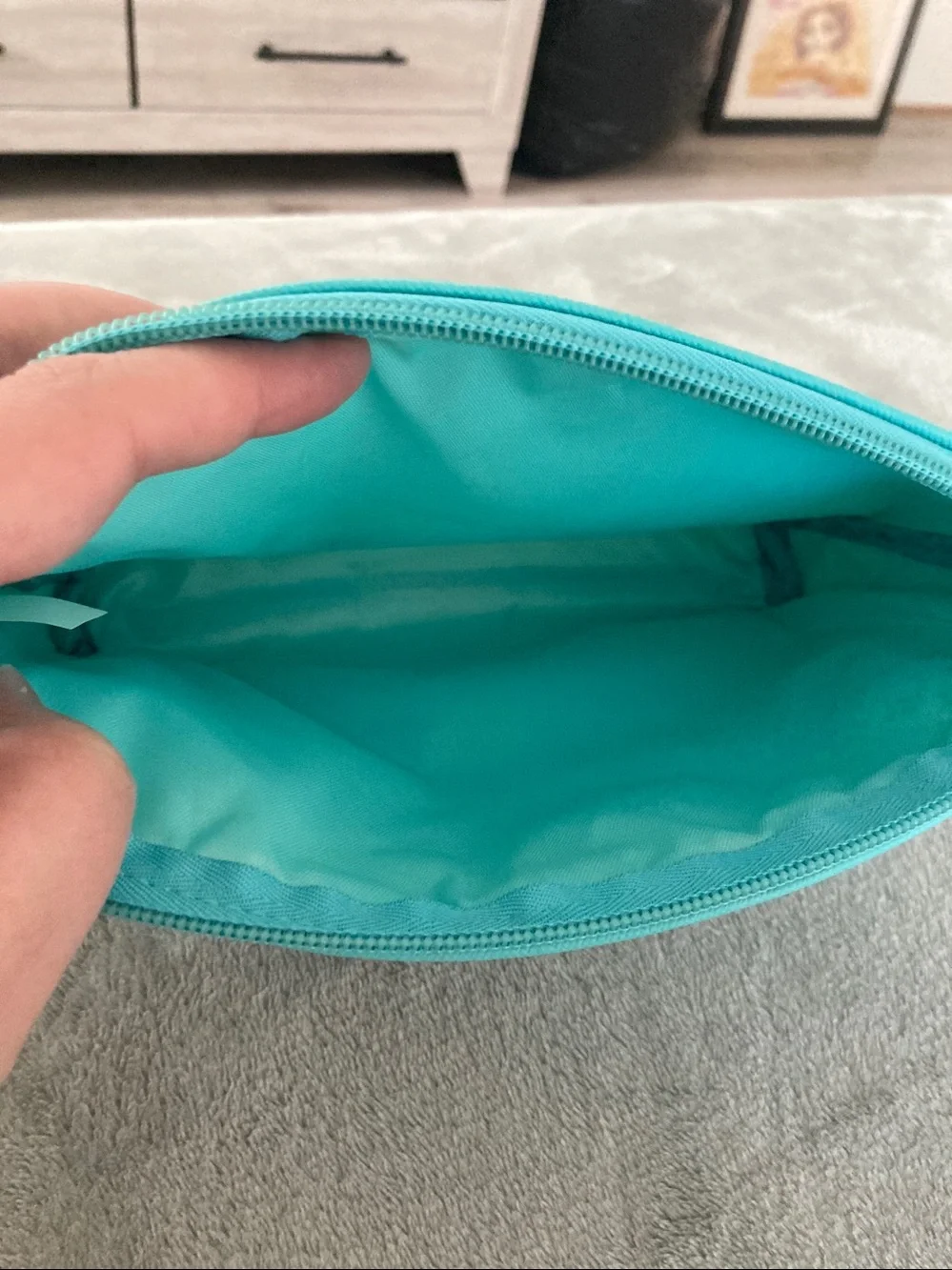 Turquoise colored faux leather cosmetic bag